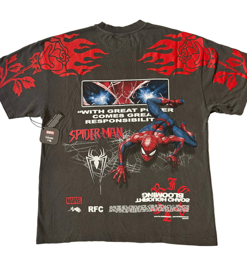 The back of a vintage black Civil Regime x Marvel Spider-Man graphic T-shirt featuring a large illustration of Spider-Man crawling forward on a spiderweb. Above the illustration is a rectangular graphic of Spider-Man's glowing blue eyes, accompanied by the white text quote, "WITH GREAT POWER COMES GREAT RESPONSIBILITY." Large red roses wrapped in flames stretch across the upper back and sleeves, while inverted white "BLOOMING THROUGH CHAOS" text sits near the bottom hem alongside Marvel, Civil Regime, and R