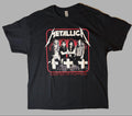 Front view of an official licensed Metallica unisex short-sleeve graphic t-shirt in black featuring the vintage Master of Puppets band photo and graveyard crosses artwork.