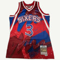 Mitchell & Ness Allen Iverson Philadelphia 76ers 1996-97 Hardwood Classics jersey with a sublimated red and blue splash graphic, featuring a stacked Sixers chest logo and number 3.