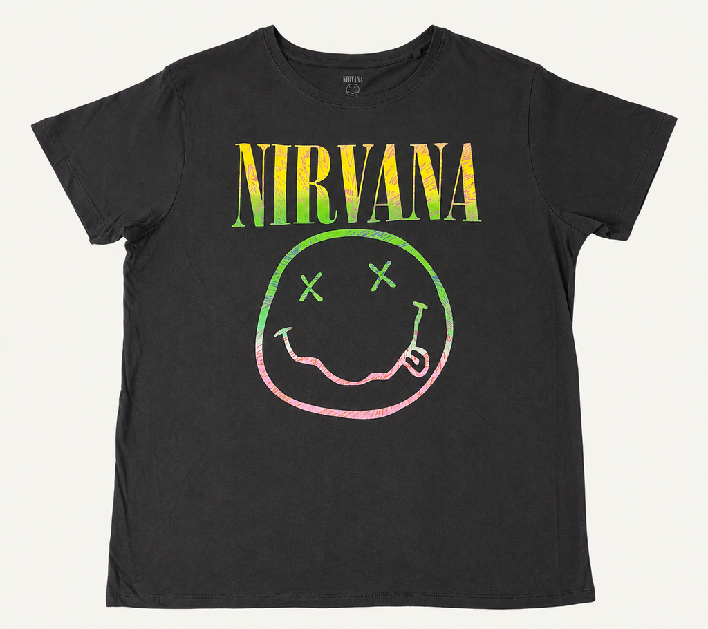Front flat lay view of an official Nirvana ladies' black graphic t-shirt featuring the arched yellow logo and the iconic cross-eyed smiley face graphic in a colorful sorbet pastel gradient print.