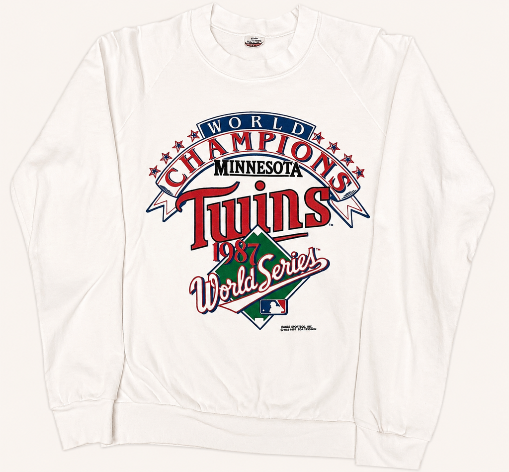 Vintage 1987 Minnesota Twins white crewneck sweatshirt featuring a multi-colored World Series Champions center chest screenprint.