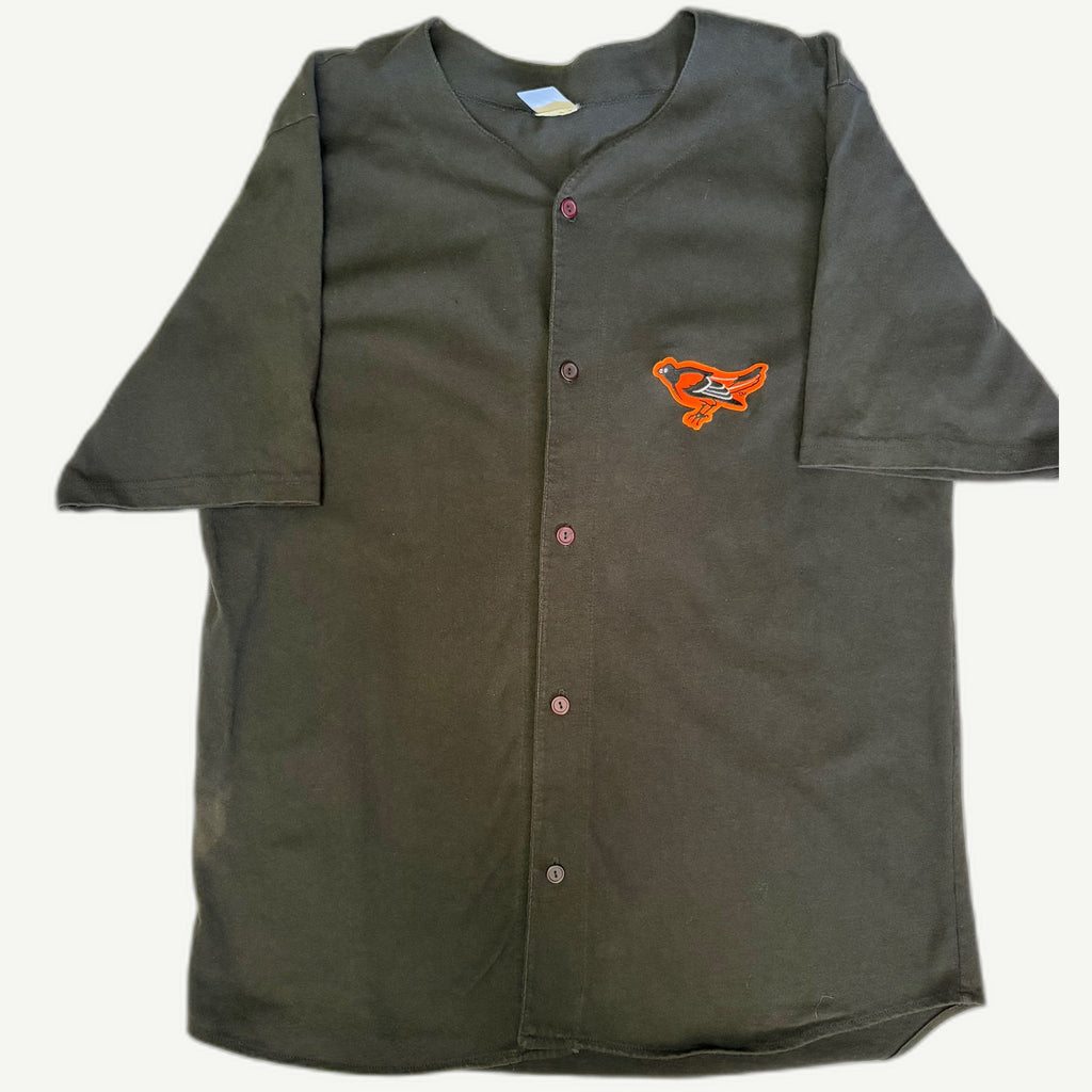 Front view and detail shots of a vintage 1990s Baltimore Orioles MLB black knit short-sleeve button-up lifestyle fashion jersey shirt with embroidered orange bird chest patch by Logo 7