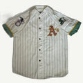 Front and back view of vintage early 1990s Oakland Athletics MLB white button-up baseball jersey with green pinstripes, dual sleeve patches, and felt back tailsweep spellout by Starter