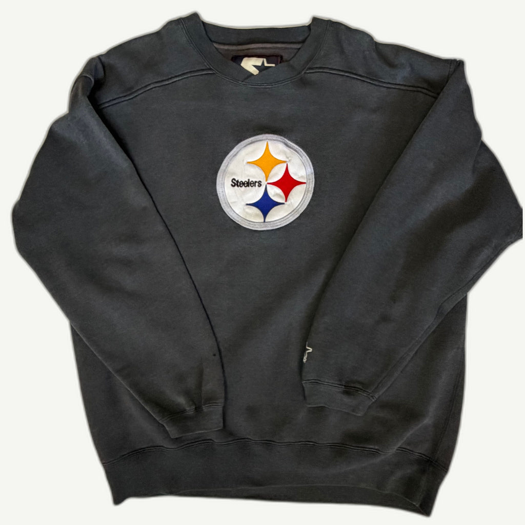 Front view of vintage mid-1990s Pittsburgh Steelers NFL dark charcoal grey crewneck sweatshirt featuring a massive direct-sewn circular tackle-twill chest center logo by Starter