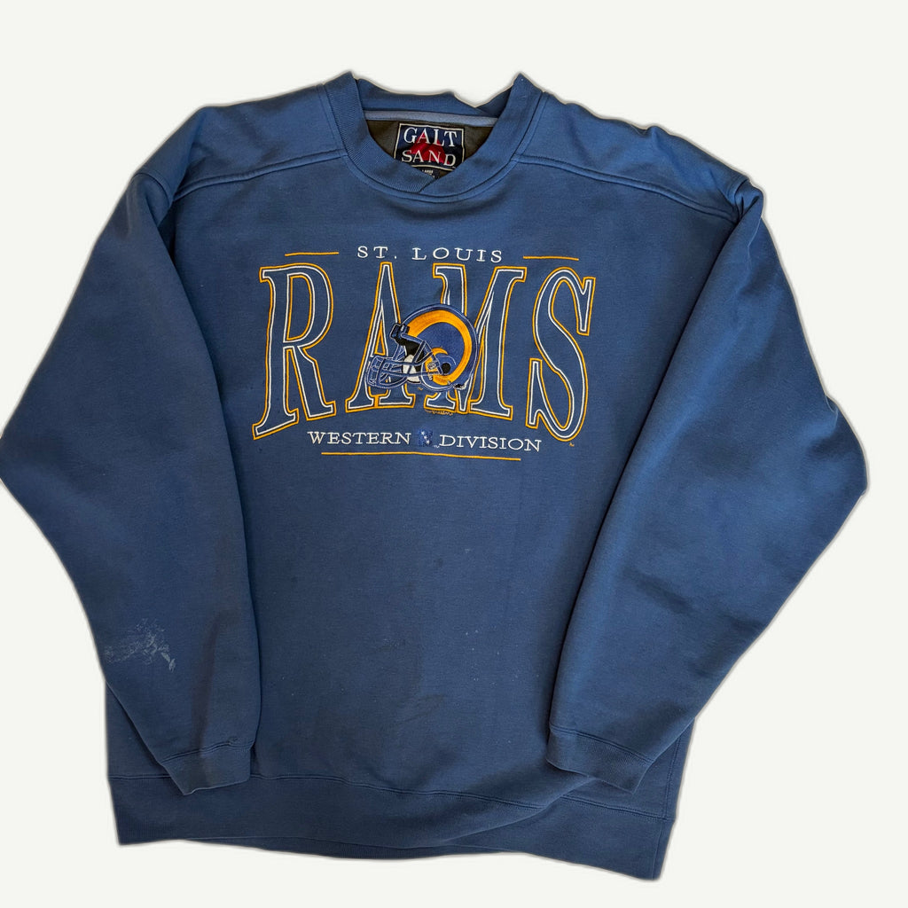 Front view of vintage late 1990s St. Louis Rams NFL royal blue crewneck sweatshirt featuring a mixed-media embroidered and screenprinted Western Division chest layout by Galt Sand