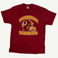 Front view of vintage early 1990s Washington Redskins NFL football single-stitched burgundy graphic tee with center-chest helmet screenprint by Trench Manufacturing Co