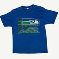 Front view of vintage 1994 Seattle Seahawks NFL royal blue single-stitched graphic tee featuring a geometric split-panel design framing the retro hawk head logo by Competitor
