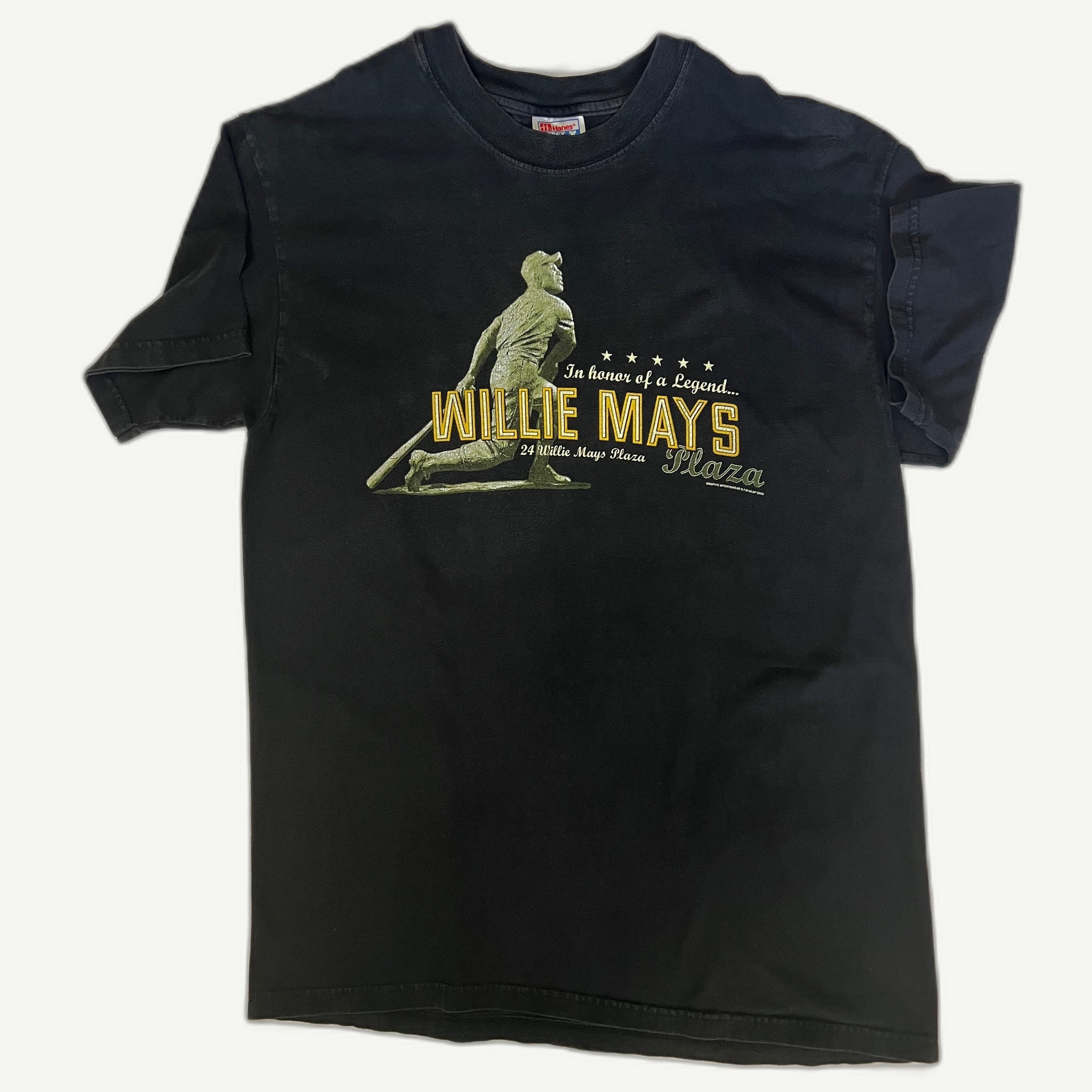 Front view of vintage 2000 San Francisco Giants Willie Mays Plaza stadium commemorative graphic t-shirt on a black Hanes Beefy-T blank