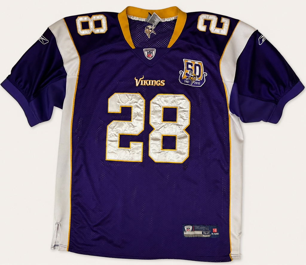 Front and back view of vintage 2010 Adrian Peterson Minnesota Vikings NFL purple jersey with 50th anniversary patch by Reebok Equipment