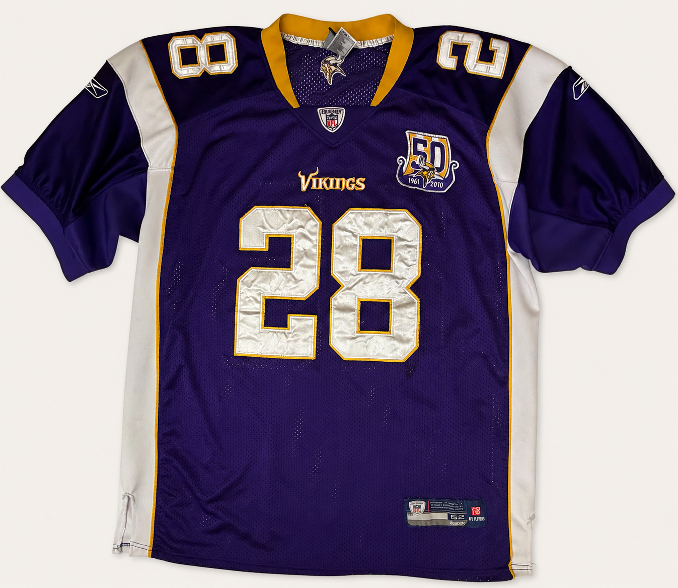 Front and back view of vintage 2010 Adrian Peterson Minnesota Vikings NFL purple jersey with 50th anniversary patch by Reebok Equipment