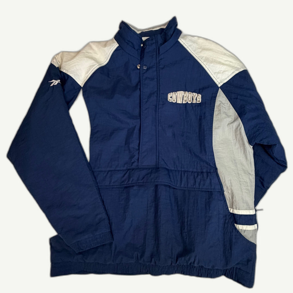 Front and back view of vintage 1990s Dallas Cowboys NFL Pro Line heavy insulated navy anorak jacket with big back star logo by Reebok