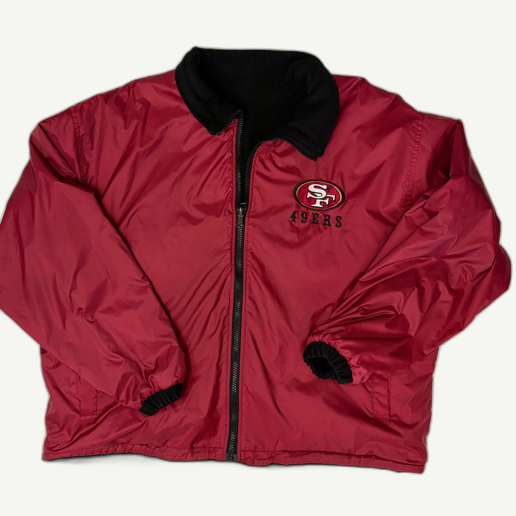 Front and back view of vintage 1990s San Francisco 49ers NFL reversible full-zip stadium jacket by Pro Player showing the embroidered SF logo
