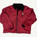 Front and back view of vintage 1990s San Francisco 49ers NFL reversible full-zip stadium jacket by Pro Player showing the embroidered SF logo